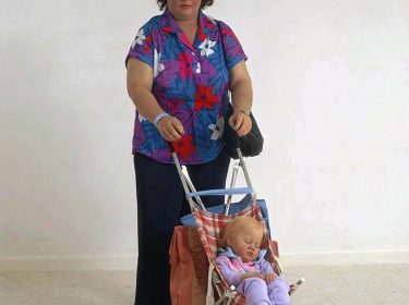 Woman with Child in a Stroller